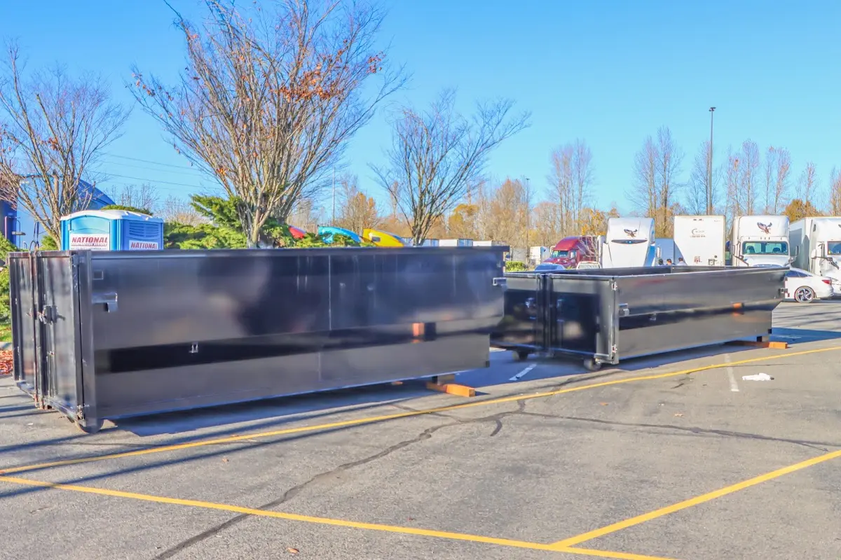 Professional dumpster rental service with roll-off container on residential driveway in San Anselmo